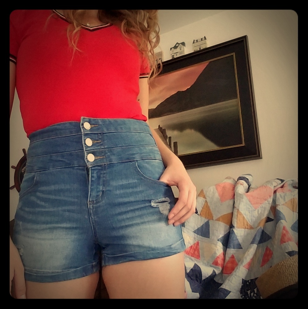 High waisted distressed blue jean shorts